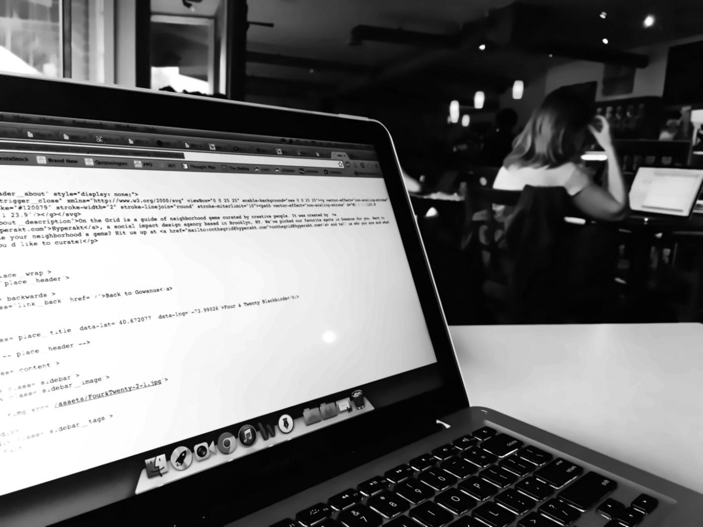 Mobile app development workspace showing code and design mockups